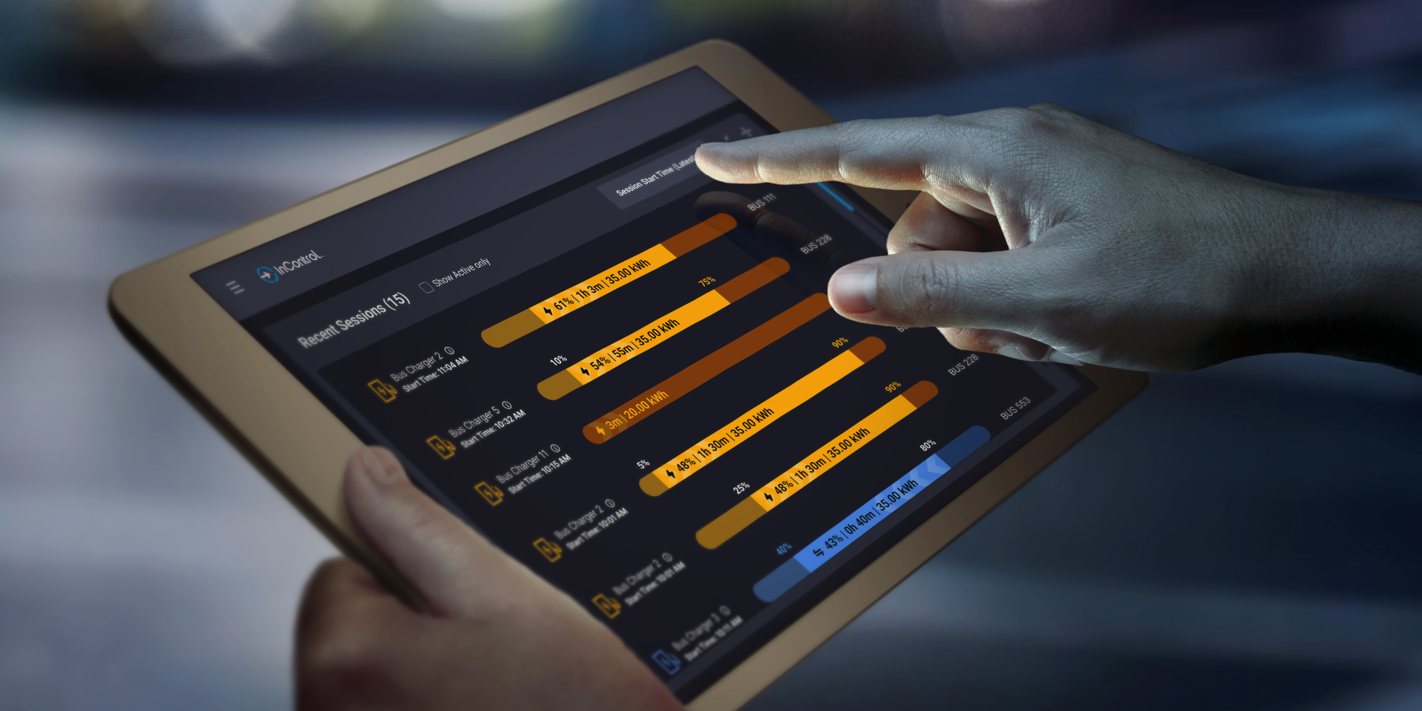 holding a tablet looking at InControl sessions