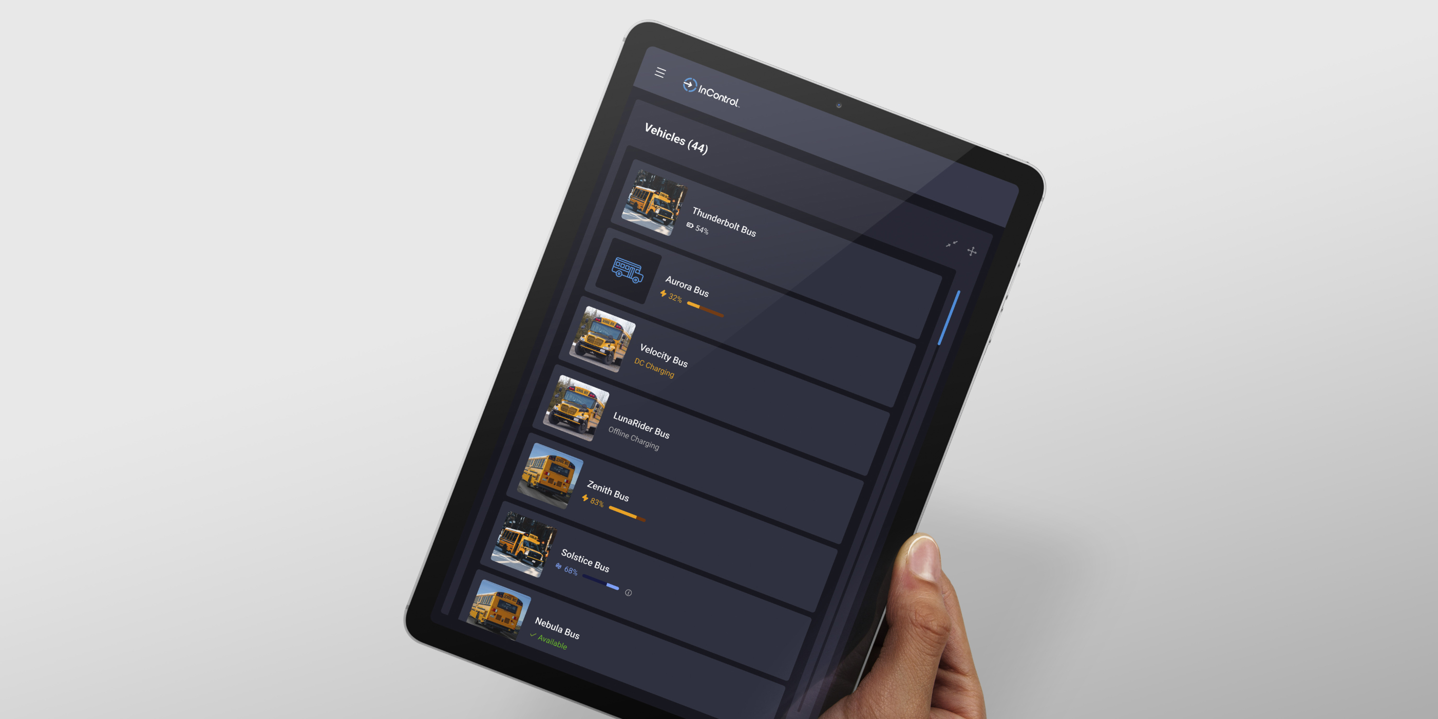 holding a tablet looking at InControl's vehicle list